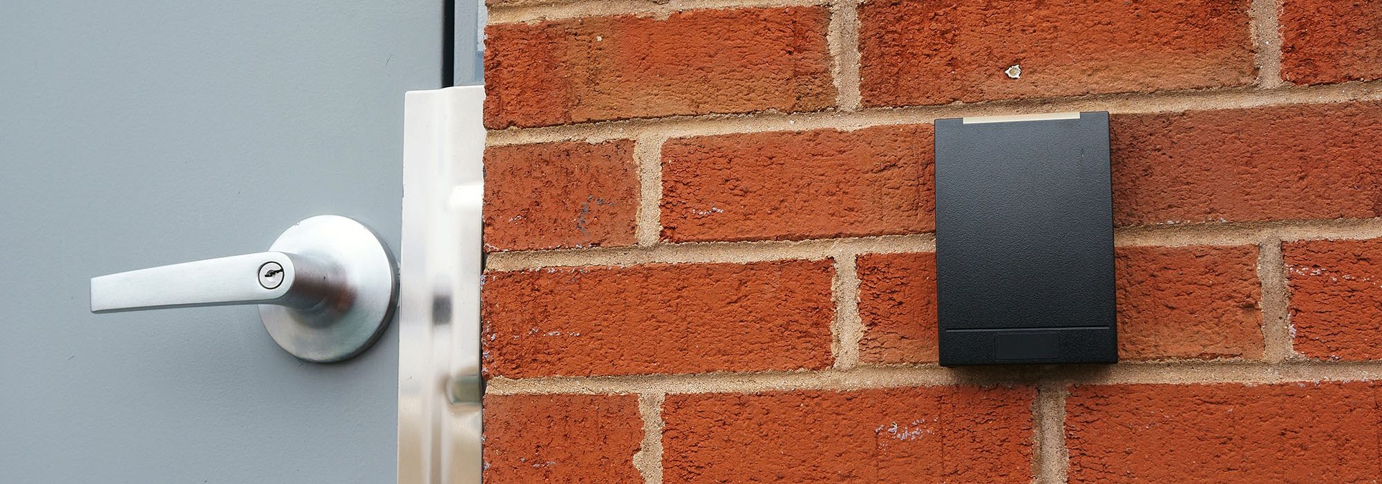 Access control pad on brick building